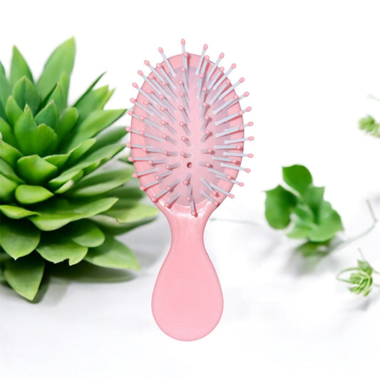 🌸 Mini Brosse à Cheveux Rose – Douceur et Praticité au Quotidien